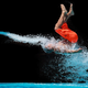 Image for article titled The Absurd Joy Of Waterslides Is Captured In These Perfectly Timed Shots